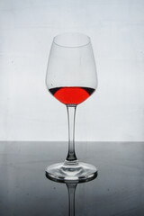Close-Up Of Red Wine Against White Background
