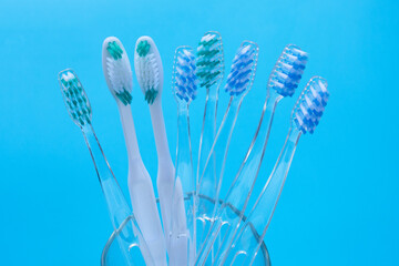 Naklejka premium Toothbrushes on blue background. Dental care concept