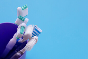 Toothbrushes on blue background. Dental care concept
