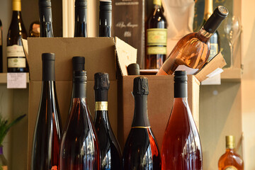 The wine is put in a box and ready for home delivery - Powered by Adobe