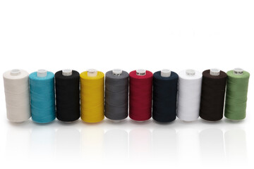 Multi-colored threads for sewing on a white background