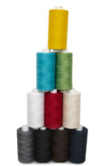 Multi-colored threads for sewing on a white background