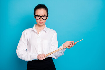 Portrait of nice attractive coacher holding in hands wooden stick secondary school isolated over...