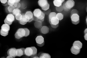 Blurred lights dark gray background. Abstract bokeh with soft light. Shiny festive christmas texture