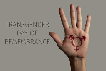 hand and text transgender day of remembrance