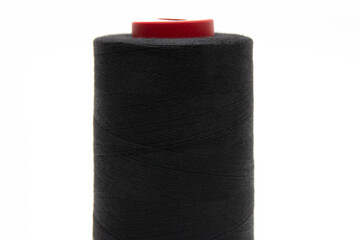 Black thread for sewing on a white background