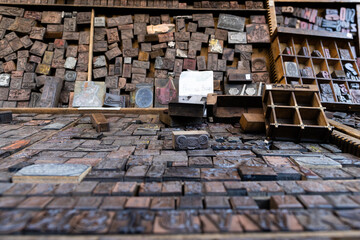 Boxes of wood letters display on a flea market