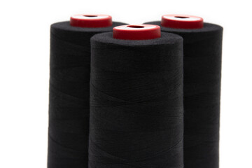 Black thread for sewing on a white background