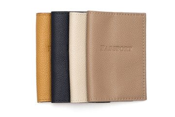 Leather covers for passport, handcrafted work. Brown, white, yellow, beige colors on a white background