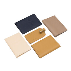 Leather covers for passport, handcrafted work. Brown, white, yellow, beige colors on a white background