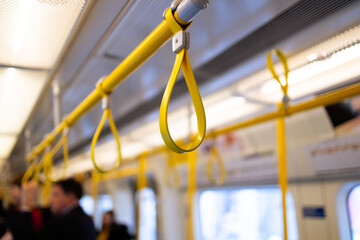 Yellow Hanging Strap in a public transport