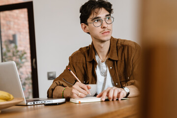 Handsome man using laptop computer