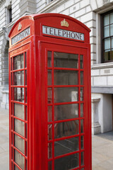 Red iconic telephone booth on the street