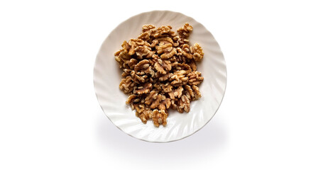 Walnuts in a white plate isolated