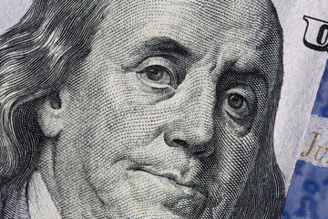 Texture of dollar bills. One hundred dollars. Close-up, macro.