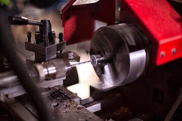 Drill holes with a drill on a lathe.
