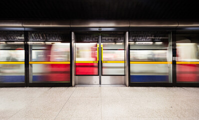 fast moving train in London subway station