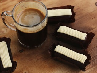 Americano coffee with chocolate brownies on the table