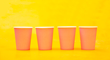 Four empty glasses on yellow banner - fullfil concept