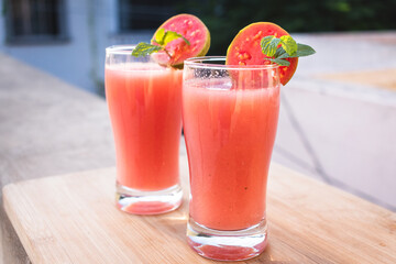 Close up shot of glass of organic Guava juice with fresh guava