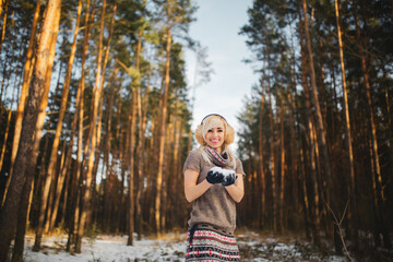 Naklejka premium portrait of a beautiful girl in a snowy forest.woman in winter park