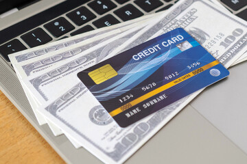 Credit card and money on a computer keyboard. shopping online concept, Online payment