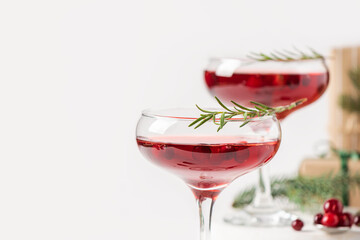 Winter drink cocktail cranberry rosemary white background.
