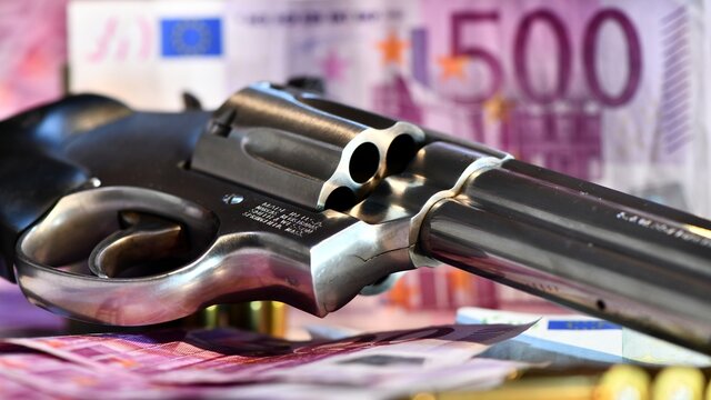 Revolver Smith e Wesson 357 magnum on a background of euro banknotes. concept of robbery, dirty money, crime