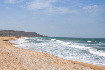 The storm and the waves of the sea. Sandy beach. Vacation, vacation, privacy,
