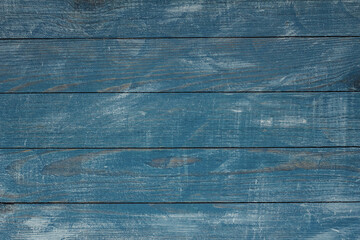 Vintage blue wood background texture with knots and nail holes. Old painted wood wall. Blue abstract background. Vintage wooden dark blue horizontal boards. Front view with copy space