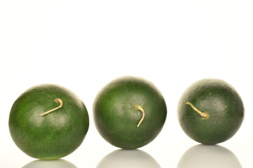 Ripe organic watermelons, close-up, on a white background.