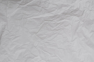 Crumpled white paper background.