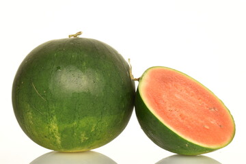 Ripe organic watermelons, close-up, on a white background.
