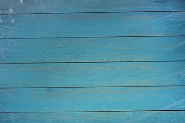 Fototapeta premium Vintage blue wood background texture with knots and nail holes. Old painted wood wall. Blue abstract background. Vintage wooden dark blue horizontal boards. Front view with copy space