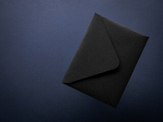 Black envelope on a blue background