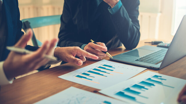 Businessmen are brainstorming for business investment strategies, charts and documents for business people.