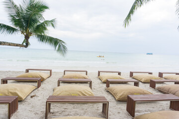 Obraz na płótnie Canvas Pillow beach chair on white sand beach