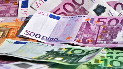 euro background. pile of 500 euro, 100 euro and 50 euro banknotes