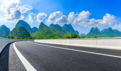 Empty asphalt highway and green mountain natural scenery in Guilin,China.