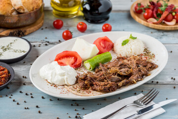 tandir kebab traditional turkish cuisine. Roasted lamb and rice pilaf with salad.