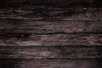 Naklejka premium Vintage brown wood background texture with knots and nail holes. Old painted wood wall. Brown abstract background. Vintage wooden dark horizontal boards. Front view with copy space