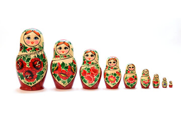 A set of nesting dolls lined up from largest to smallest