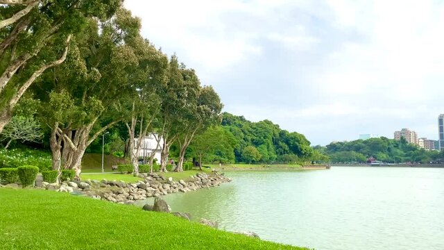 A gentle breeze rippled the surface of the lake. Film at Bihu Park, Taipei, Taiwan. It's a suitable park for exercise, picnics, fishing and taking a walk.