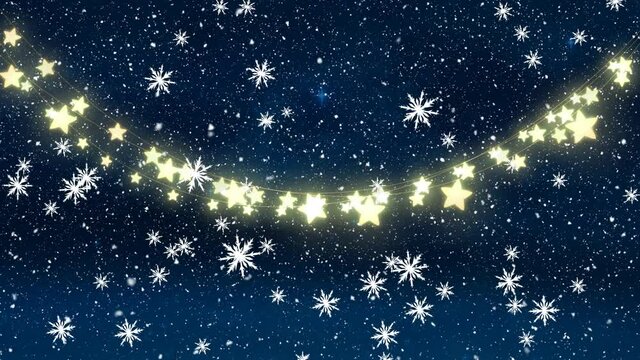 Digital animation of snowflakes falling over glowing fairy lights against blue background