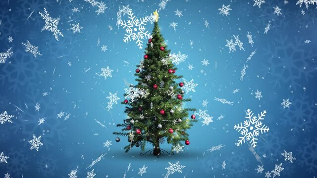 Digital animation of snow flakes falling over christmas tree on blue background