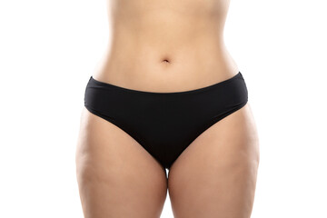 Fototapeta na wymiar Front view. Overweight woman with fat cellulite legs and buttocks, obesity female body in black underwear isolated on white background. Orange peel skin, liposuction, healthcare and beauty treatment.