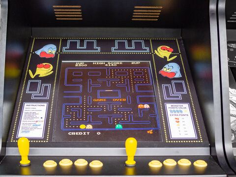 TERRASSA, SPAIN-MARCH 19, 2019: Screen and controls of Pac-Man arcade/coin-op machine in the National Museum of Science and Technology of Catalonia