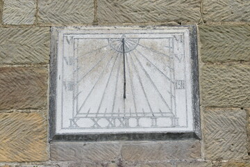 A sundial set vertically on a wall