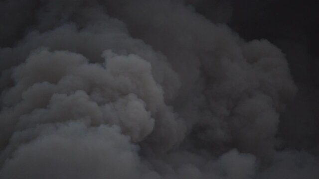 Forest fire dark and thick smoke closeup shot