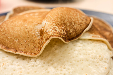 Fried thin pancakes made from wheat flour close up Photo